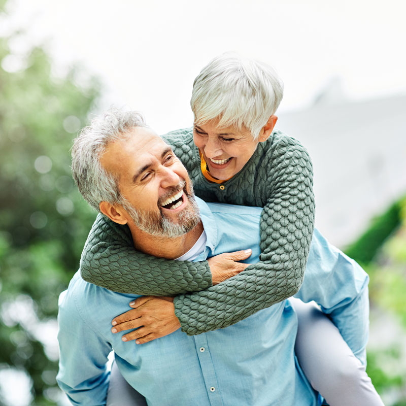 elderly couple smiling